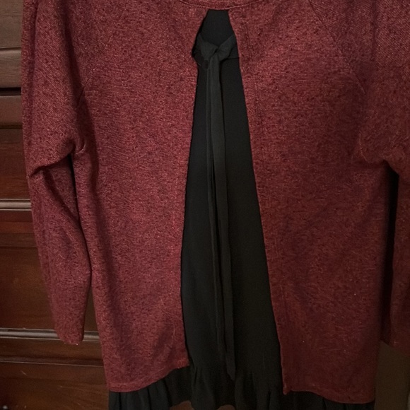 Red tunic with black ruffle details at the bottom. Black insert ribbon at back. - Picture 3 of 3